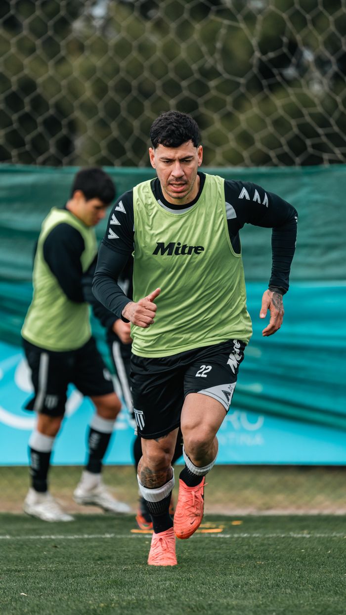 our-mission Male soccer player performing drills during an outdoor training session on the field.
